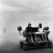 Mutant vehicles in black rock city durind sandstorm.  A Mutant Vehicle is an art car classification specifically created for use at Black Rock City and they are  the only vehicles which can run during the festival
