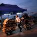 A woman carries cardboard and metal for recycling in  Hong Kong Cheung chau island