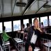 A man contemplates the Hong Kong island through a window of a shuttle boat